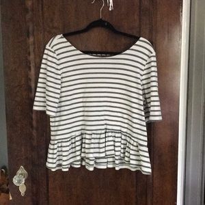 Elbow sleeve top with back cut out.